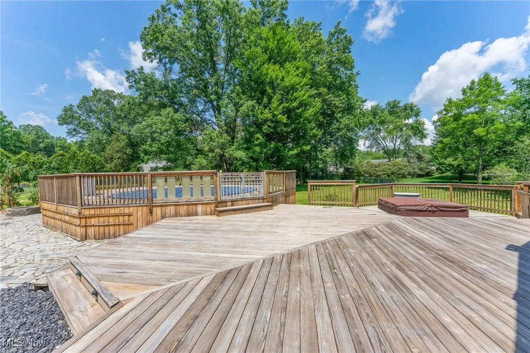 Wooden deck with view of scattered trees
