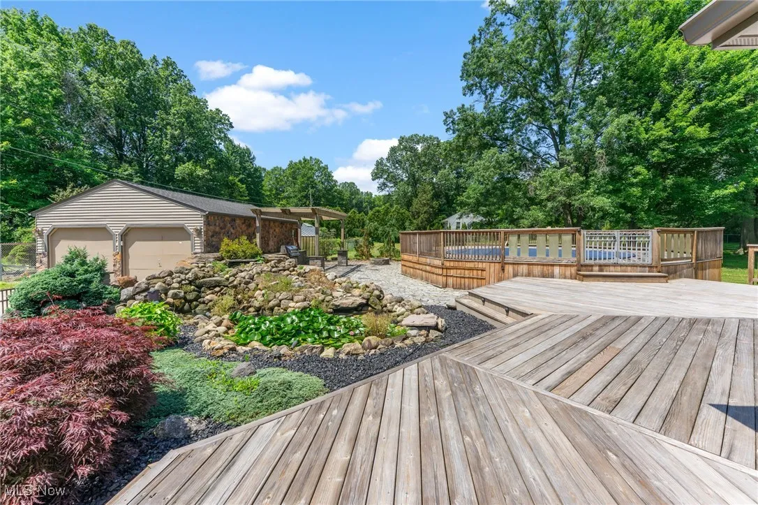 Deck with view of scattered trees