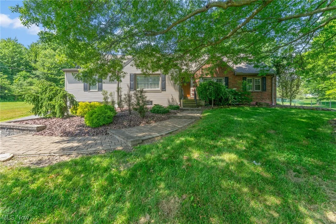 View of front of house featuring a front lawn