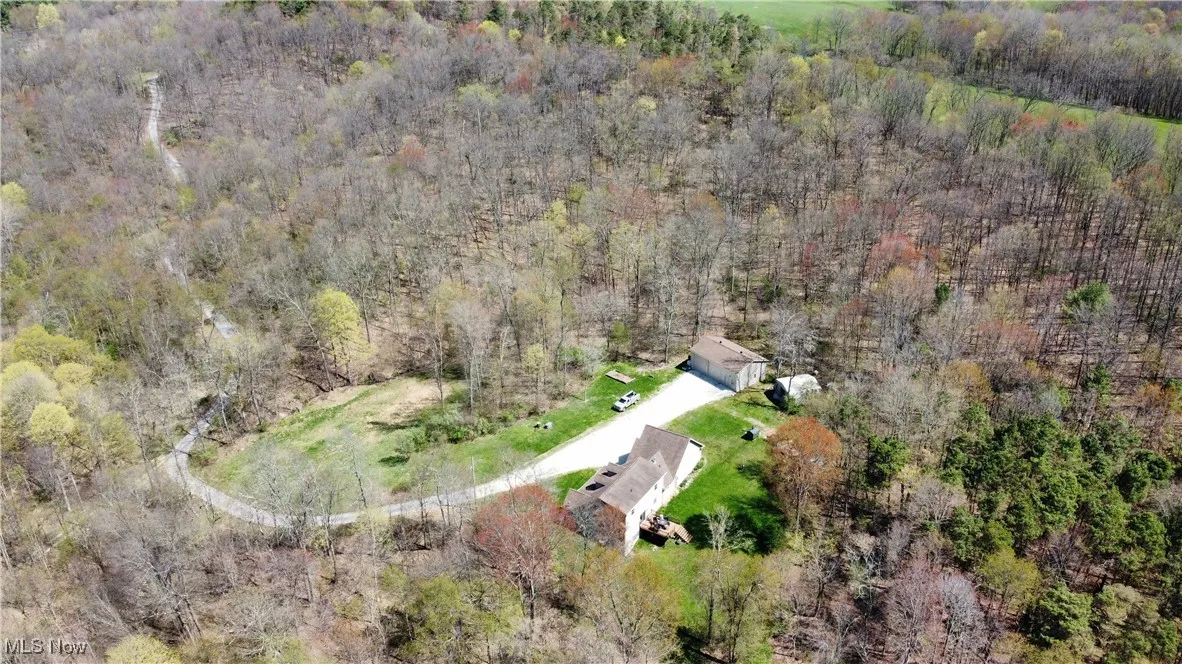 Bird's eye view with a wooded view
