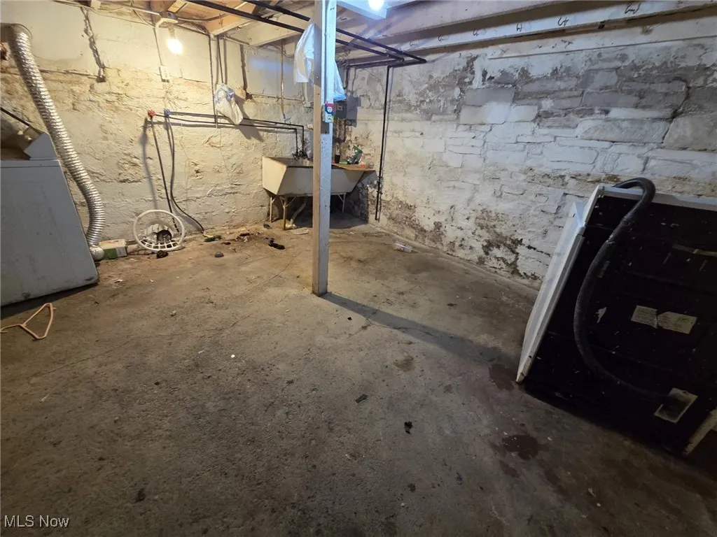 Unfinished basement featuring a sink