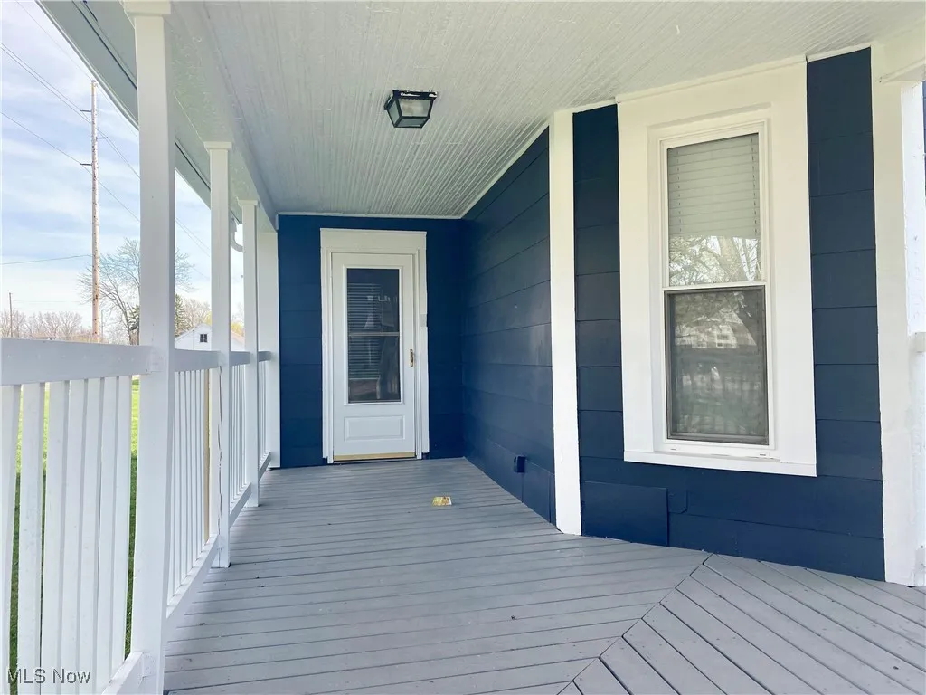 Wooden deck featuring covered porch