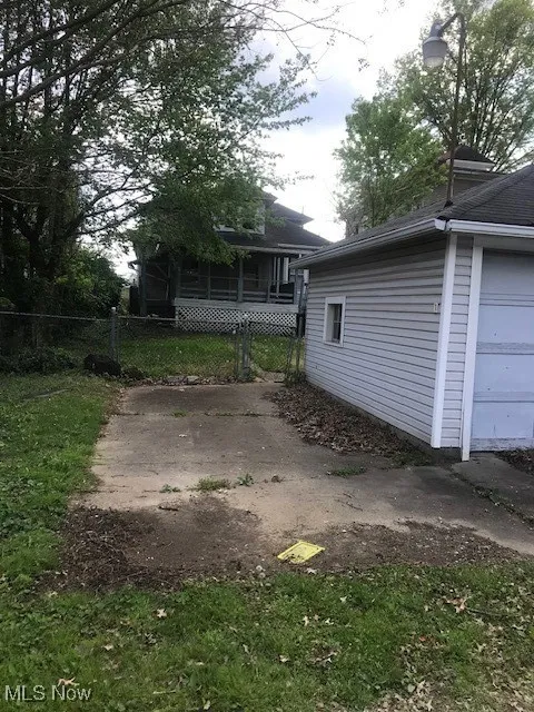 View of side of property with fence