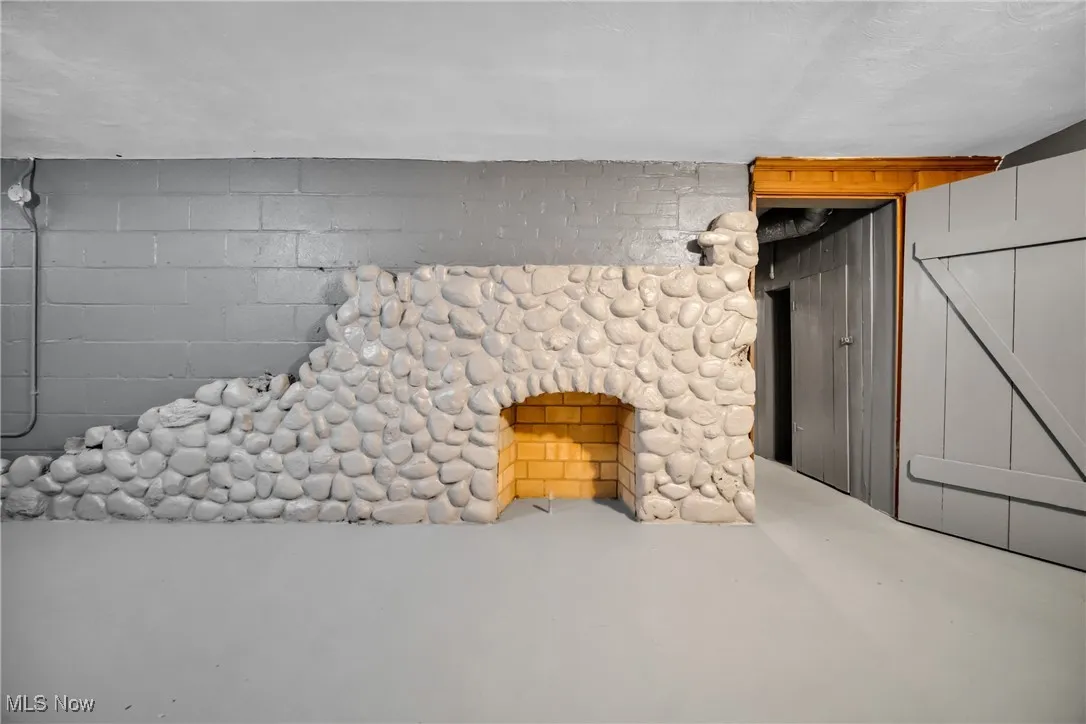 Interior details with concrete flooring and concrete block wall