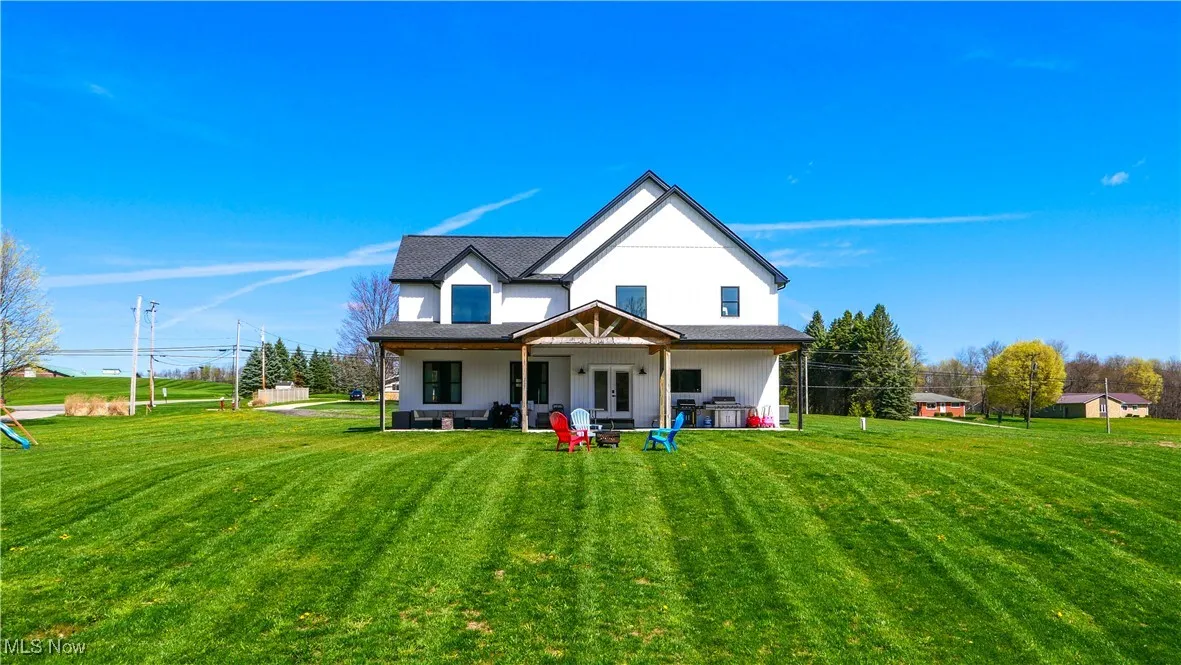 Back of house featuring french doors, a yard, and a patio