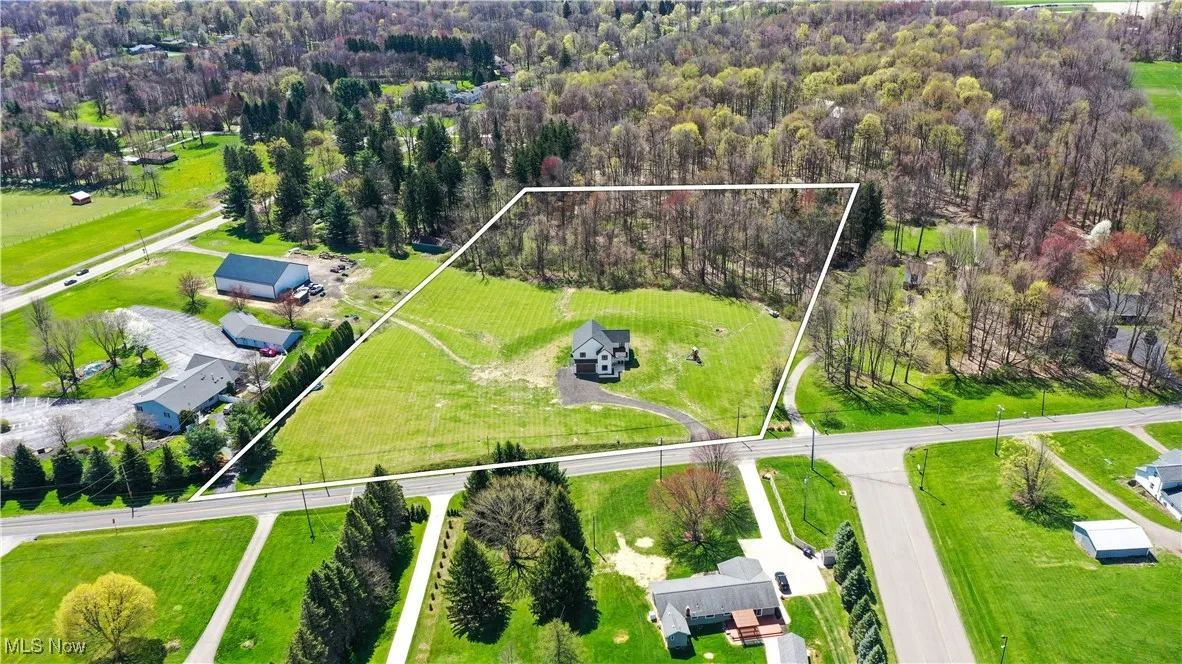 Drone / aerial view with a wooded view