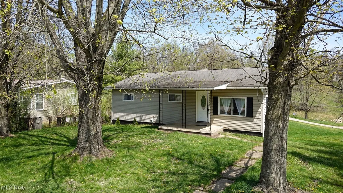 View of front of property with a front yard