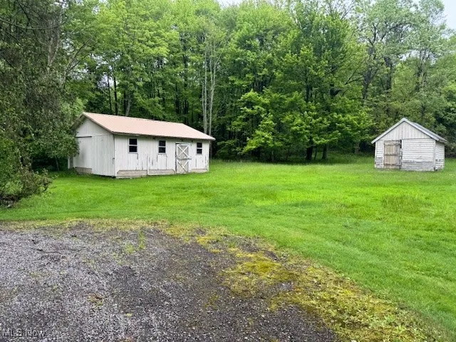 View of green lawn with an outdoor structure