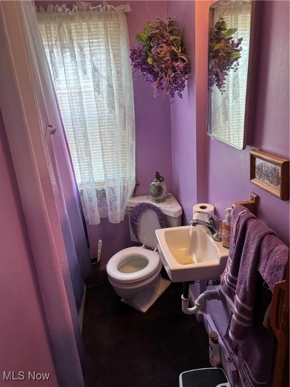 Bathroom featuring toilet and a sink