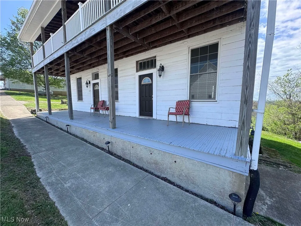 Property entrance featuring covered porch