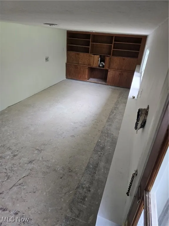 View of unfurnished bonus room in the basement.