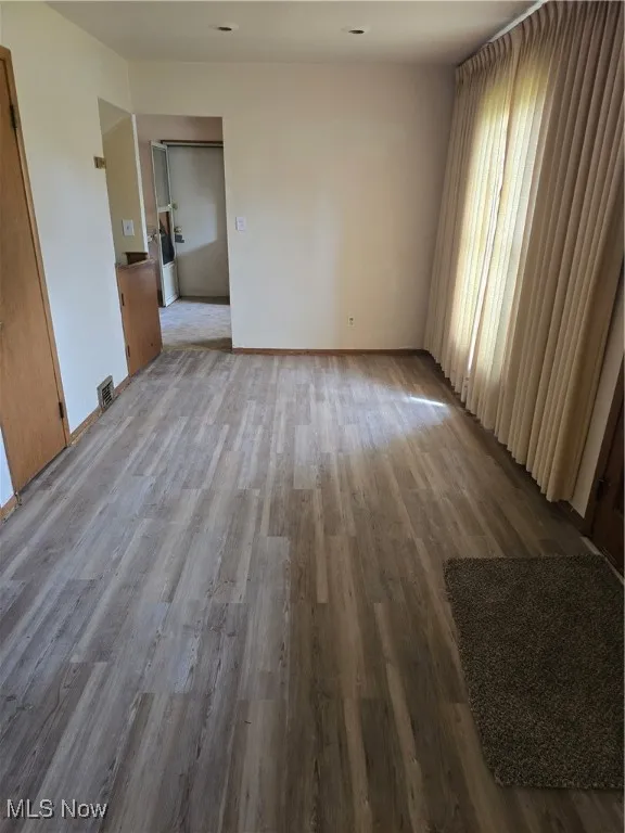 Dining Area featuring wood finished floors and baseboards