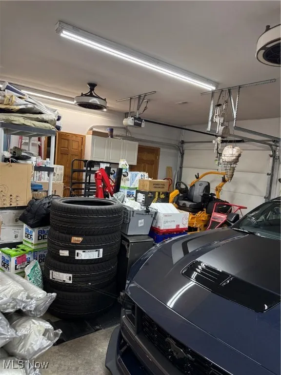 Garage featuring a garage door opener