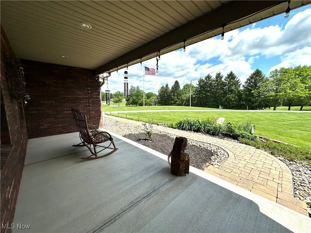 View of patio featuring view of scattered trees