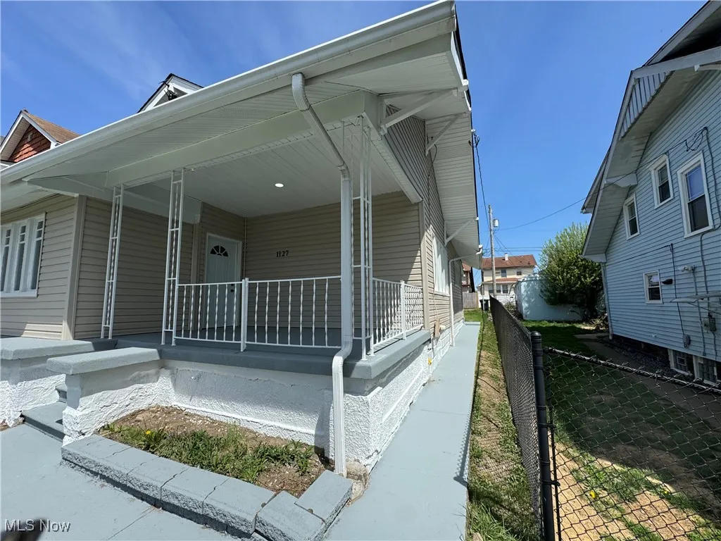 View of home's exterior with a porch