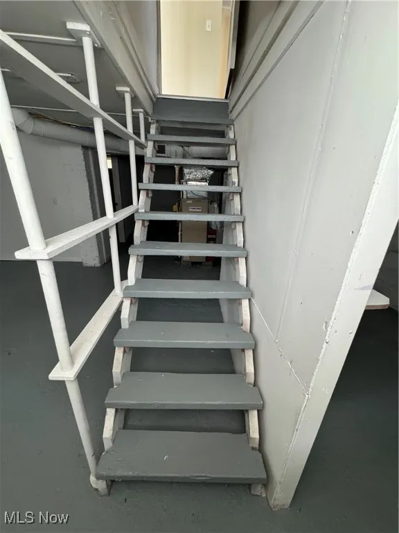 View of basement staircase heading back upstairs