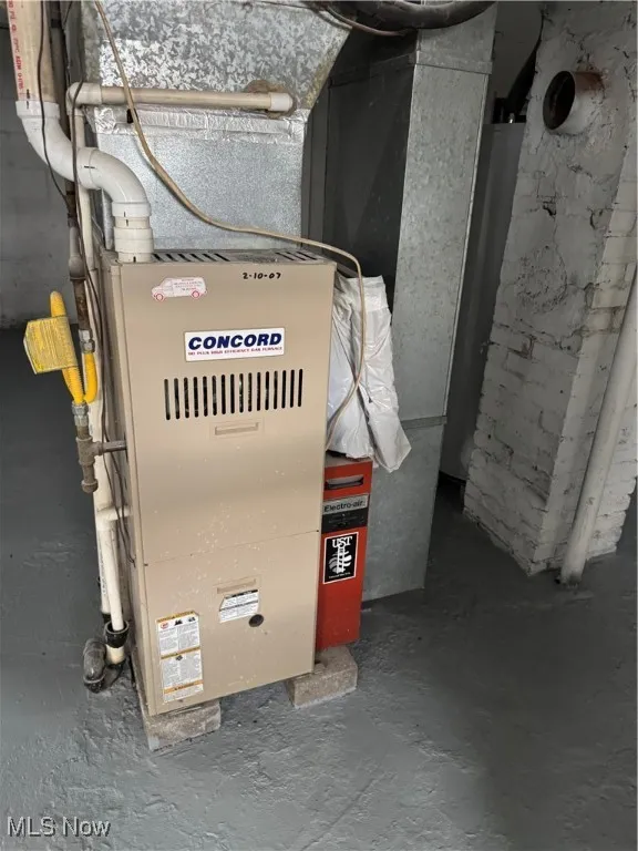 Utility area in basement showing Furnace