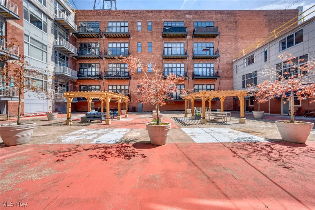 Surrounding community with a pergola and a patio area