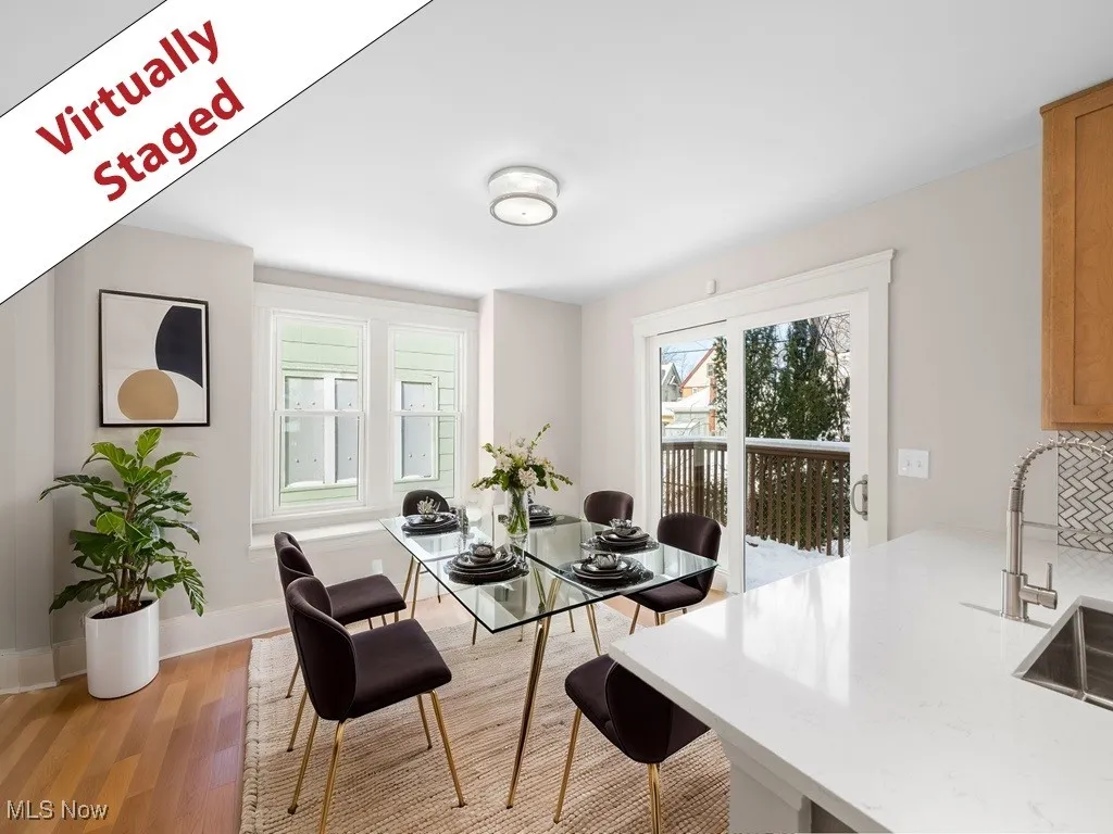Dining room with baseboards and light wood-type flooring