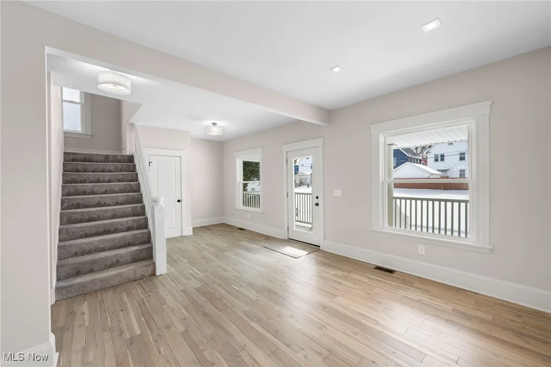 Foyer entrance featuring light wood-type flooring, and baseboards