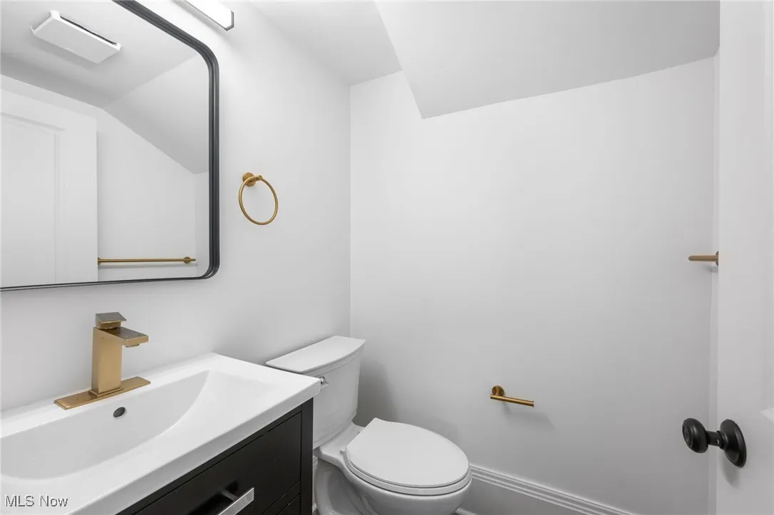 Bathroom with baseboards, toilet, and​​‌​​​​‌​​‌‌​‌‌​​​‌‌​‌​‌​‌​​​‌​​ vanity