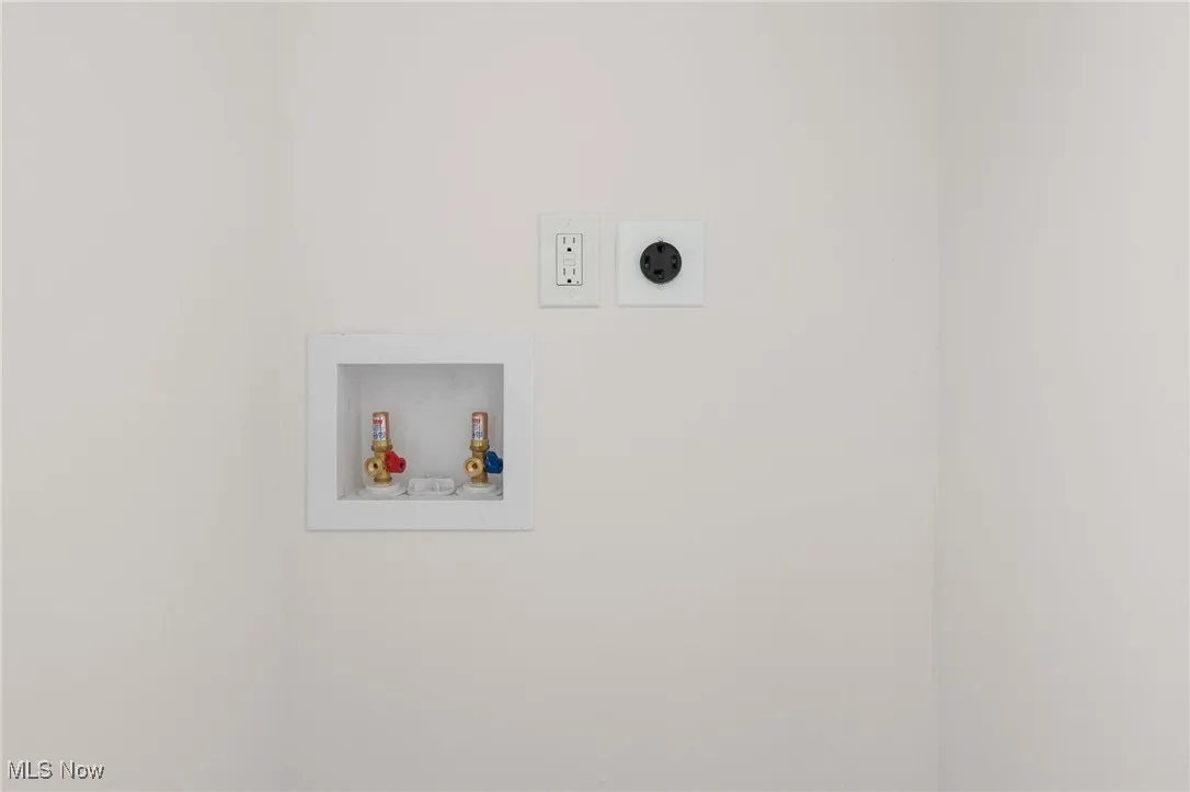 Second floor laundry area featuring washer hookup and electric dryer hookup