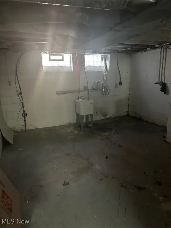Below grade area with a sink