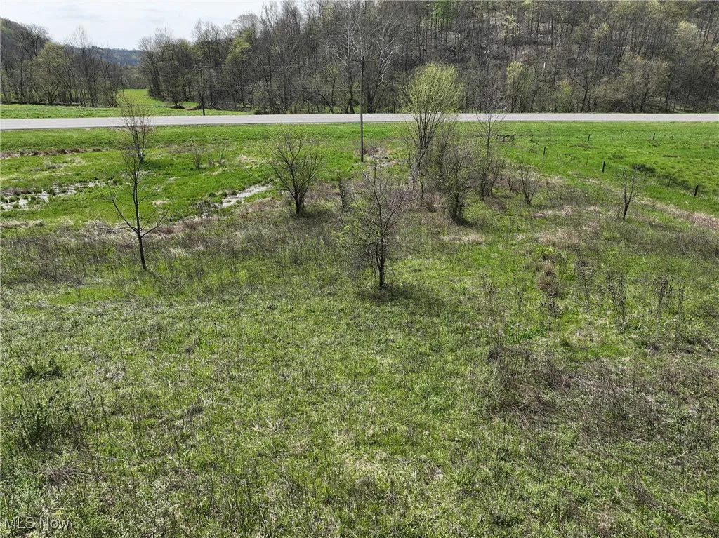 View of yard with a rural view