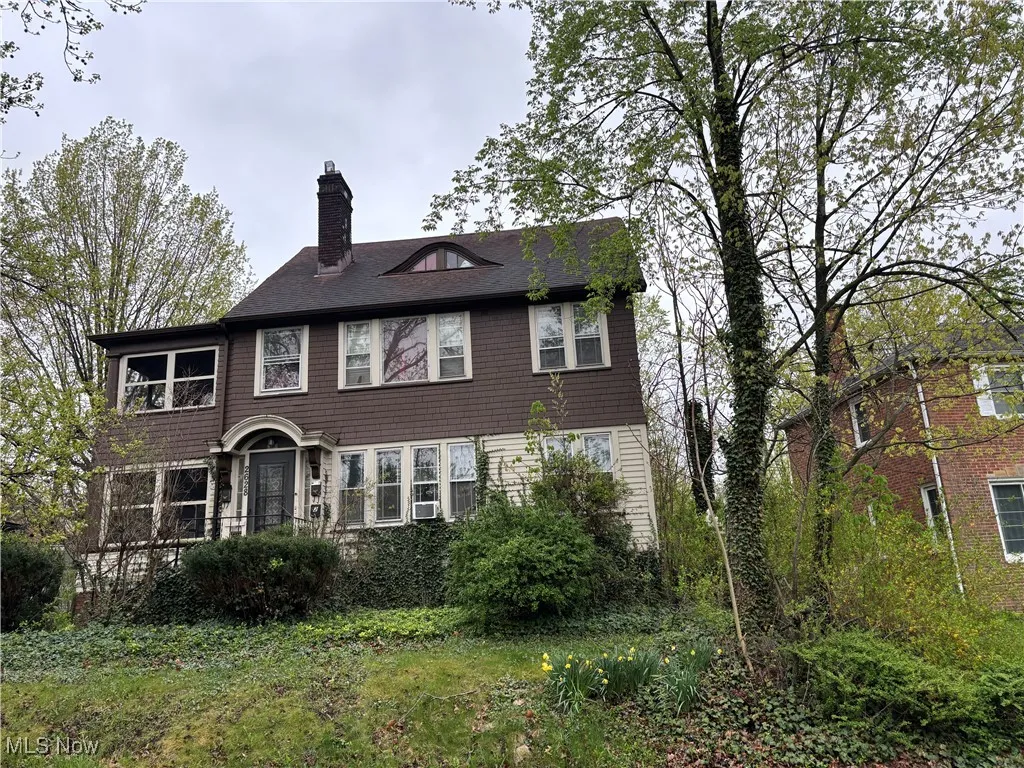 View of front of house with a chimney