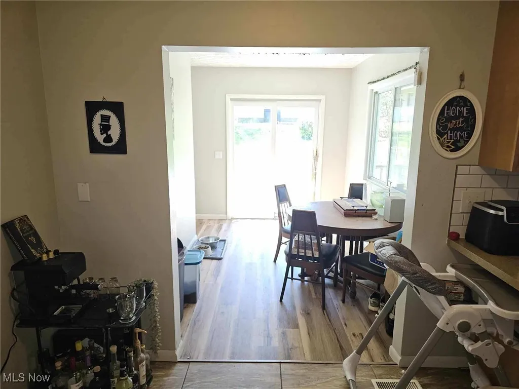 Dining room featuring baseboards and wood finished floors