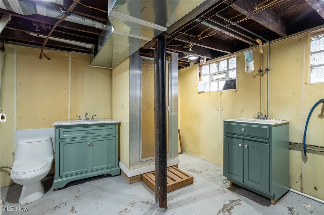 Basement featuring a sink and plenty of natural light