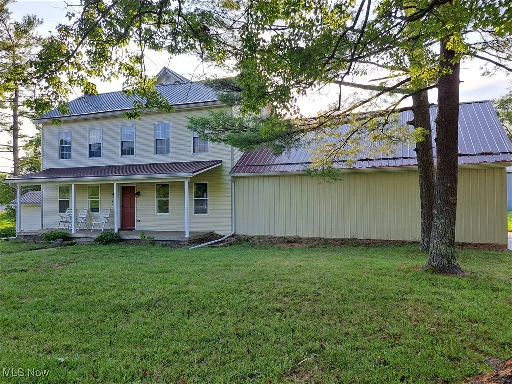 View of front of property with a front yard