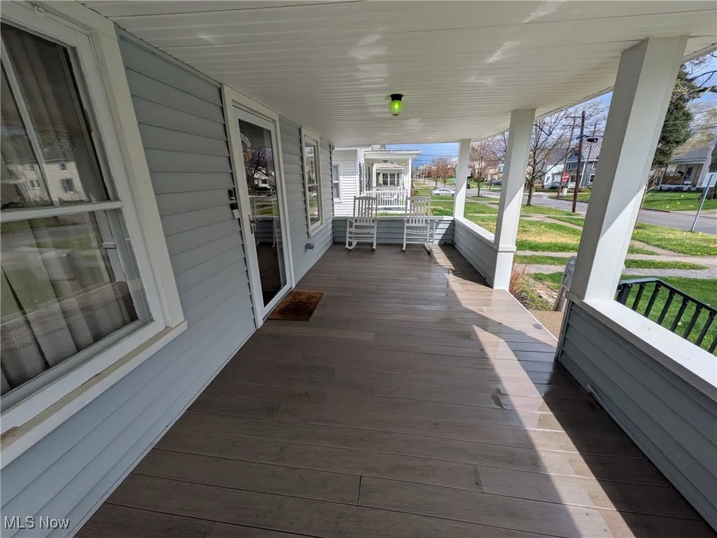 Covered front porch looking east