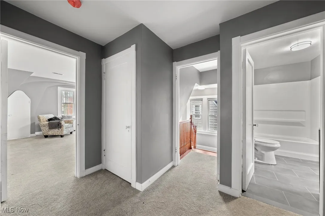 Hallway with light carpet