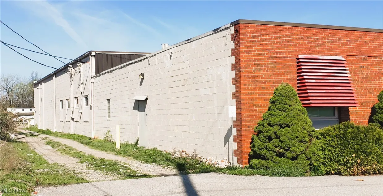 View of home's exterior with concrete block siding