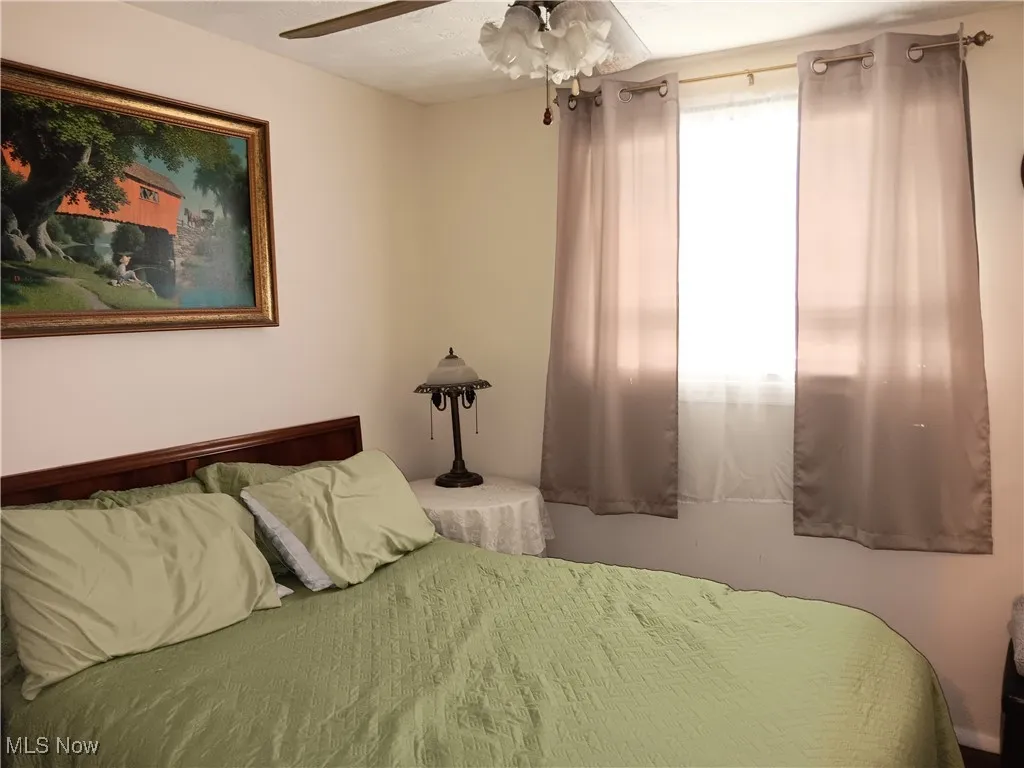 Bedroom featuring a ceiling fan