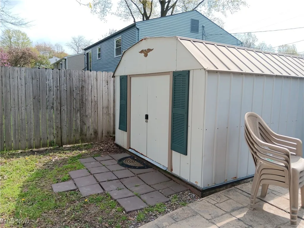 View of shed with fence