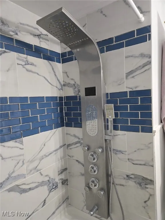 Full bathroom with shower / bathing tub combination
