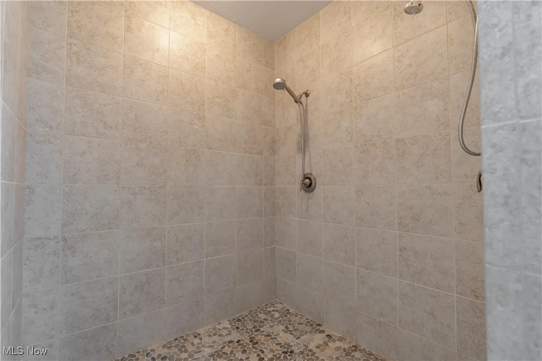 Full bath with tiled shower