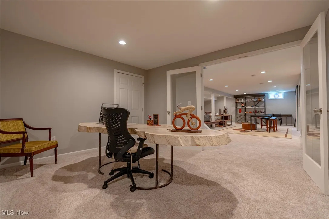 Home office featuring recessed lighting, indoor bar, carpet floors, and baseboards