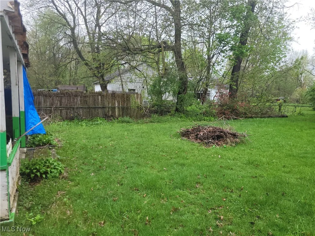 View of yard featuring fence