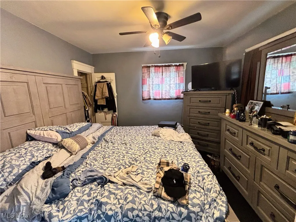 Bedroom featuring a ceiling fan