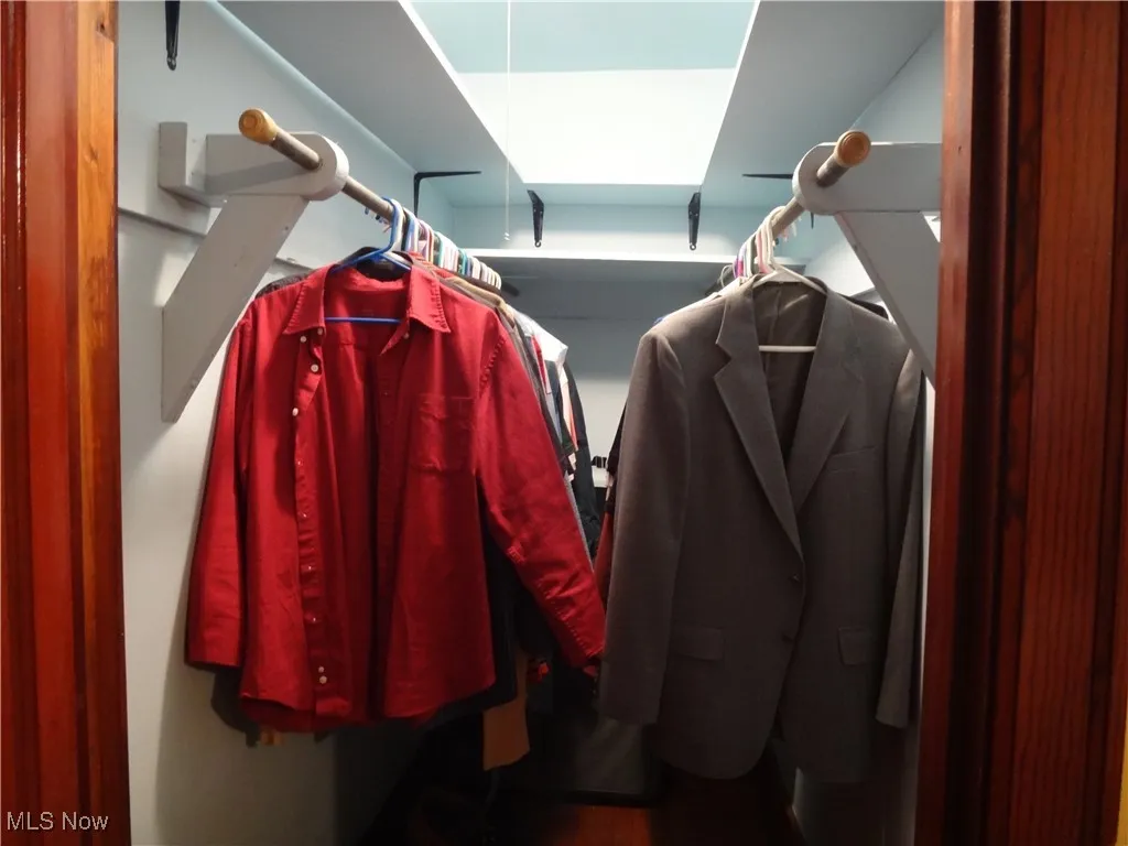View of walk in closet in master bedroom