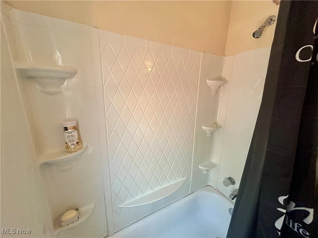 Bathroom featuring shower / bathing tub combination