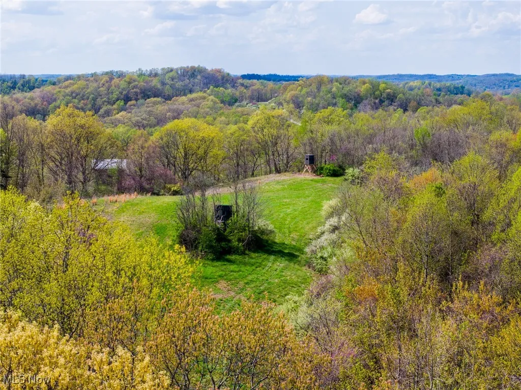 Birds eye view of property featuring a rural view