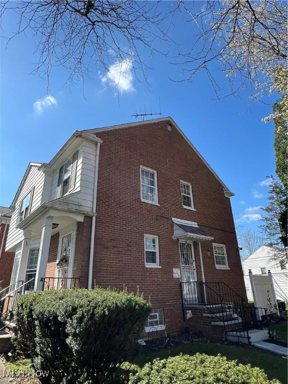 View of front of home with brick siding