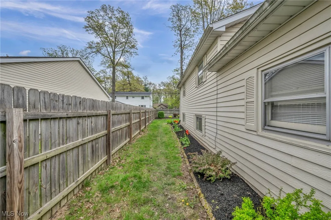 View of yard featuring fence