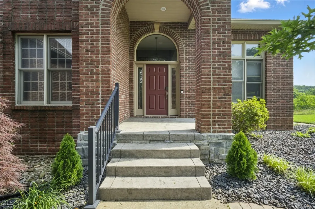 Entrance to property with brick siding