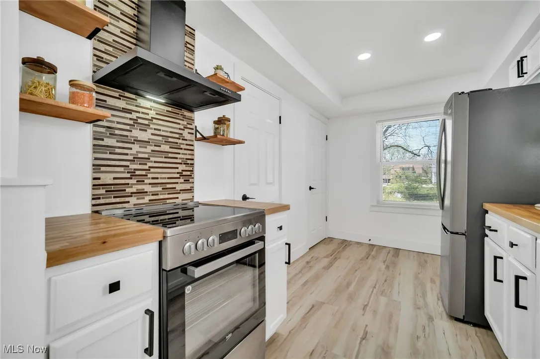 Beautifully updated kitchen with stainless steel appliances.