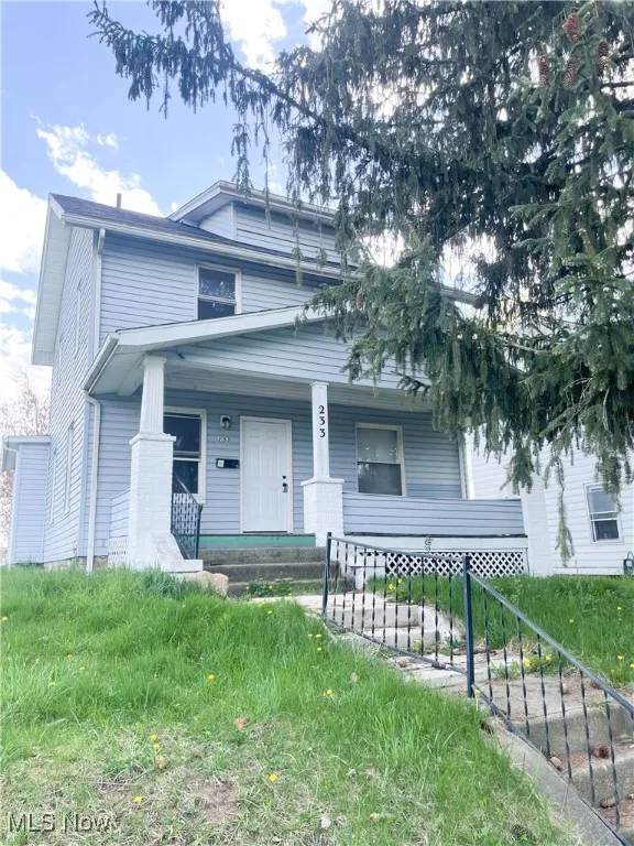 Traditional style home featuring a porch